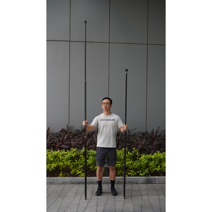 a surveyor comparing the lengths between XGRIDS K1 extension pole kit 2m and 3m modular system for elevated mobile LiDAR mapping and survey-grade stability